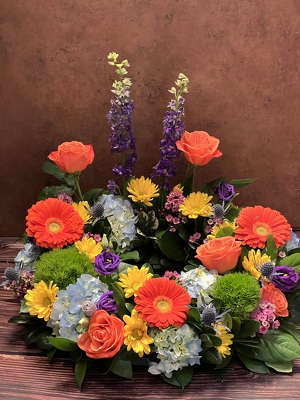 TABLE WREATH WITH BRIGHT FLOWERS from Redwood Florist in New Brunswick, NJ